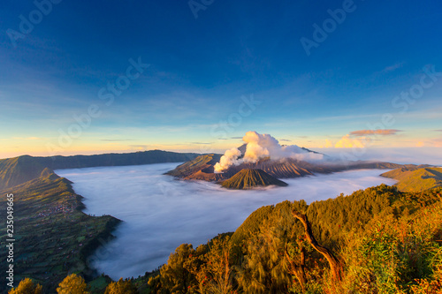 Bromo Mountain and fog around bromo mountain with sunrise from seruni viewpoint is an active volcano and part of the Tengger massif, in East Java, Indonesia. Indonesian call Gunung Bromo.