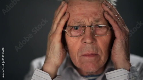 Wallpaper Mural Close up grey-haired senior wathes TV news Torontodigital.ca