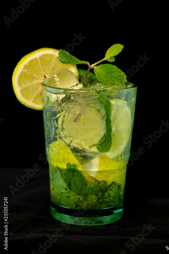 Mojito Cocktail with rum, brown sugar, lemon juice, mint and soda water