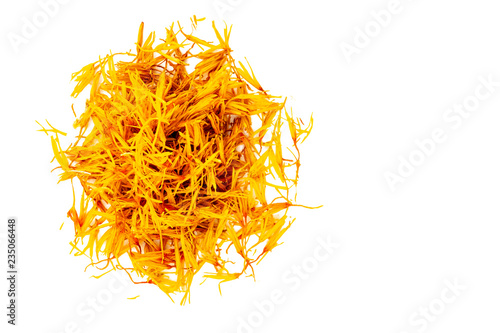 Canvas-taulu Dried yellow inflorescences of safflower dye lie in the form of a circle on a white background