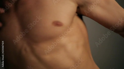 Young topless rolled man posing