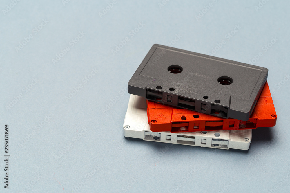 Bright retro cassette tapes on a light grey background Bright retro cassette tapes on a light grey background