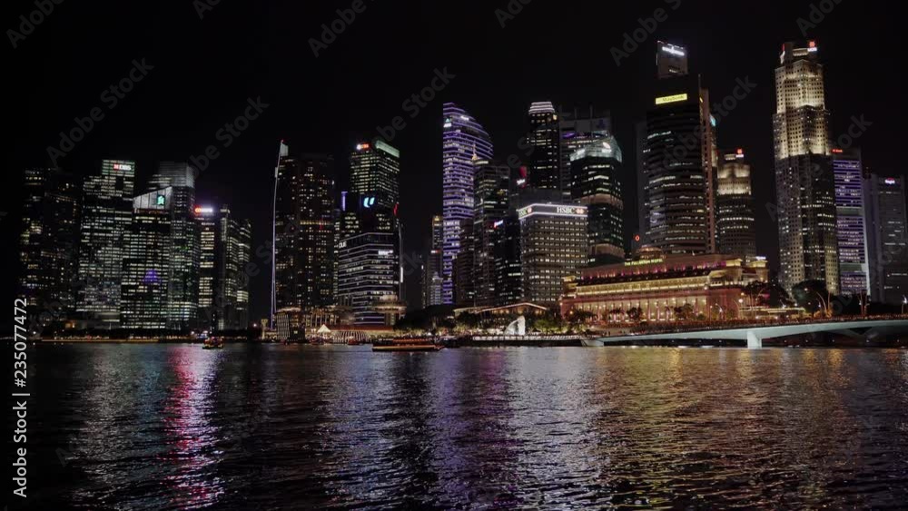 Singapore Night Skyline overlooking Singapore River in the downtown district Singapore Night Skyline overlooking Singapore River in the downtown district