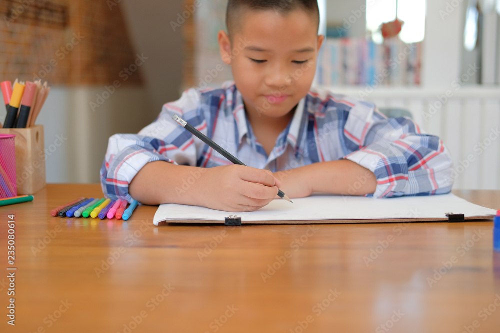 asian kid boy child schoolboy drawing picture. children activity at home asian kid boy child schoolboy drawing picture. children activity at home