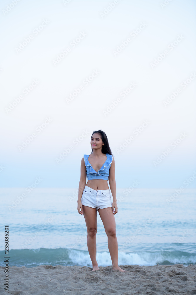 Young Beautiful Asian Tourist Woman Thinking By The Beach Young Beautiful Asian Tourist Woman Thinking By The Beach