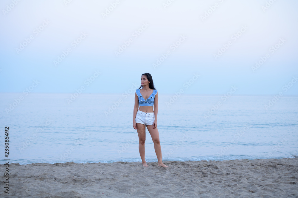 Young Beautiful Asian Tourist Woman Thinking By The Beach