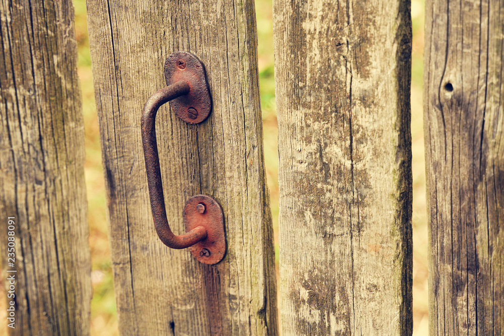 old door with rusty metal handle old door with rusty metal handle