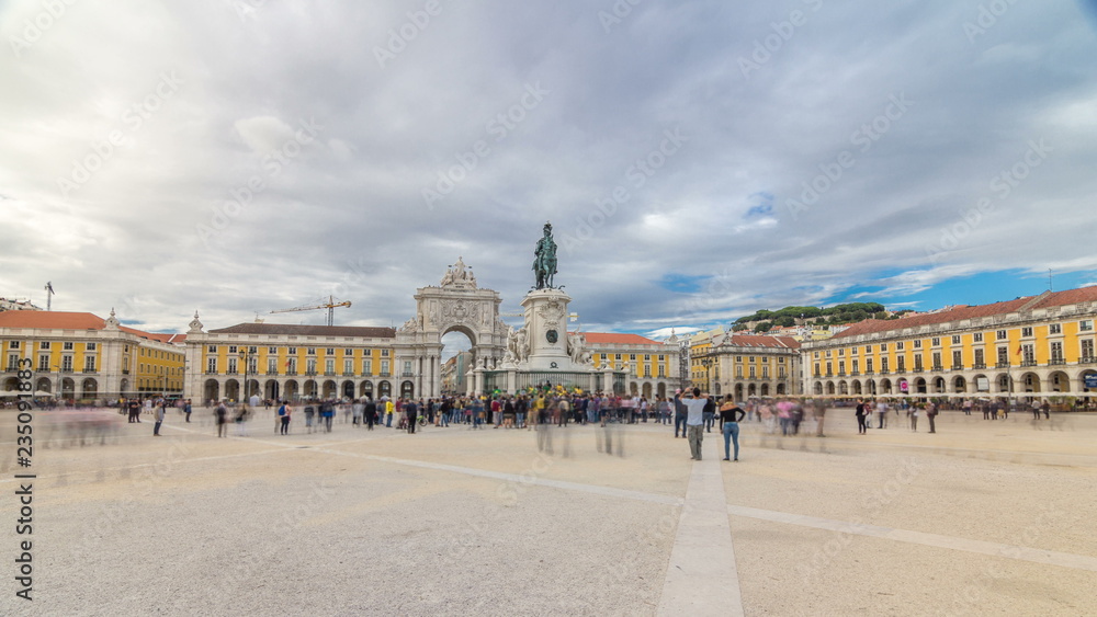 Triumphal arch at Rua Augusta and bronze statue of King Jose I at Commerce square timelapse hyperlapse in Lisbon, Portugal.