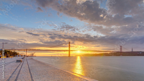 Lisbon city sunrise with April 25 bridge night to day timelapse