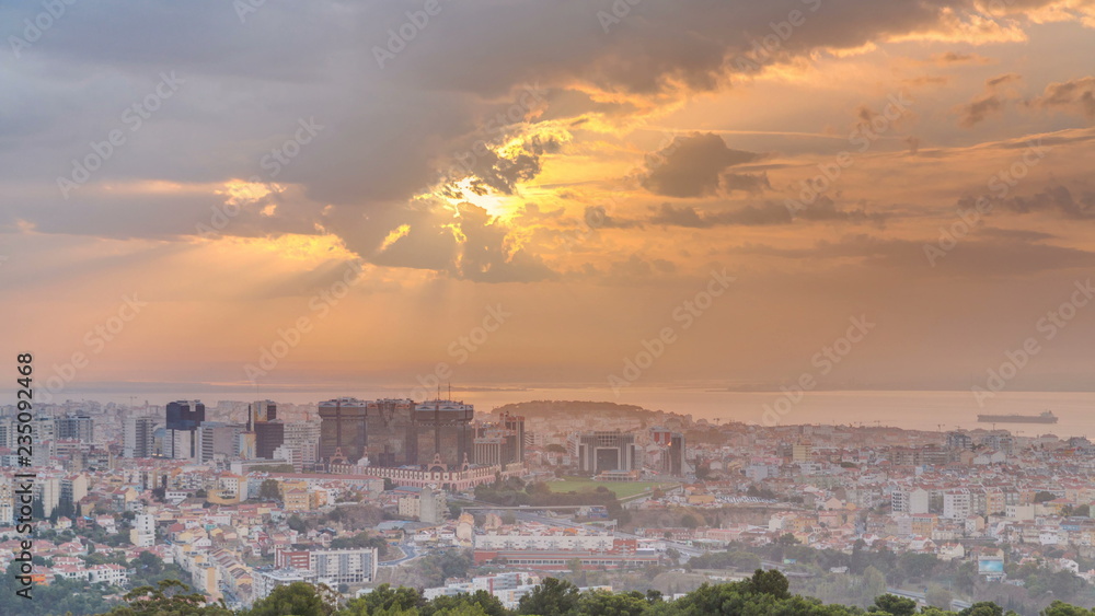 Panoramic sunrise view over Lisbon and Almada from a viewpoint in Monsanto morning timelapse.