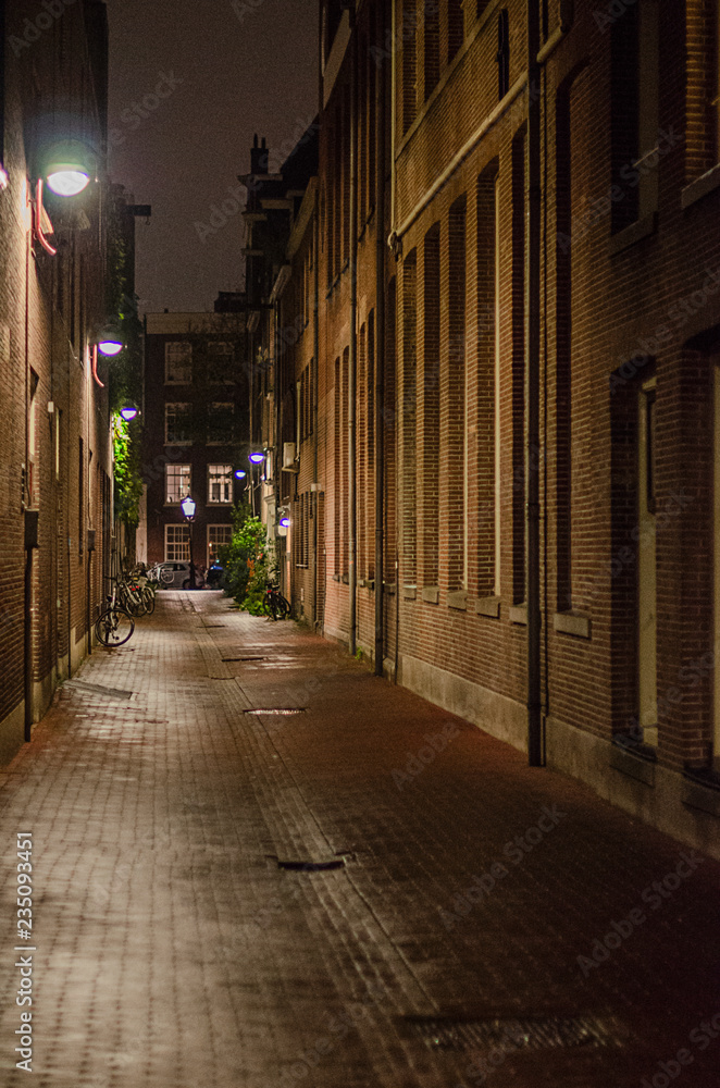 narrow street in amsterdam in the evening narrow street in amsterdam in the evening