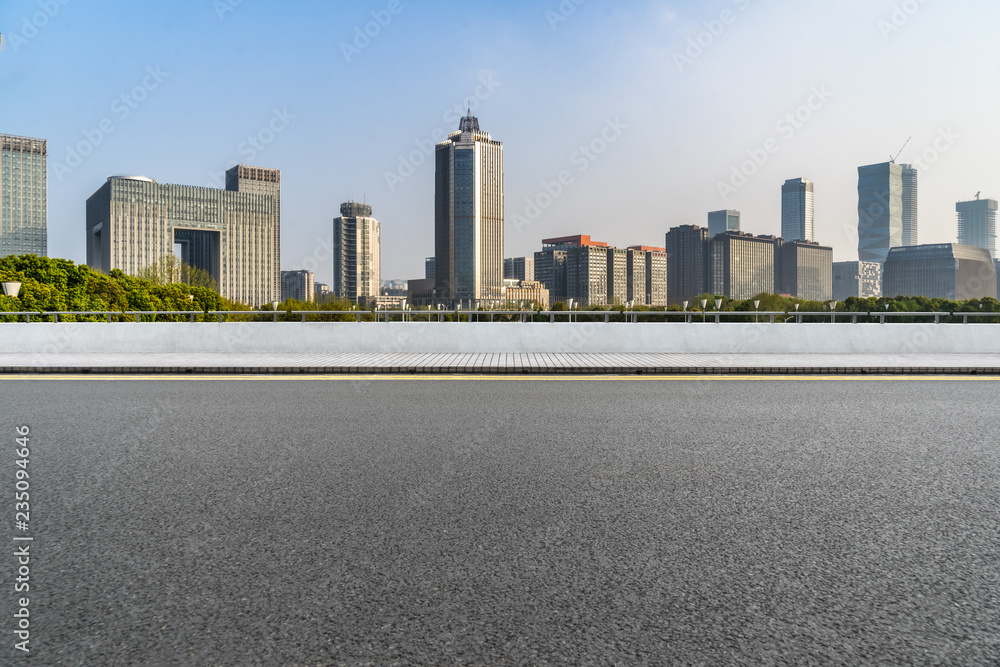 urban traffic road with cityscape in background, China. urban traffic road with cityscape in background, China.