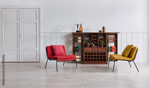 White wall classic background red yellow chair, wooden cabinet retro and book objects.