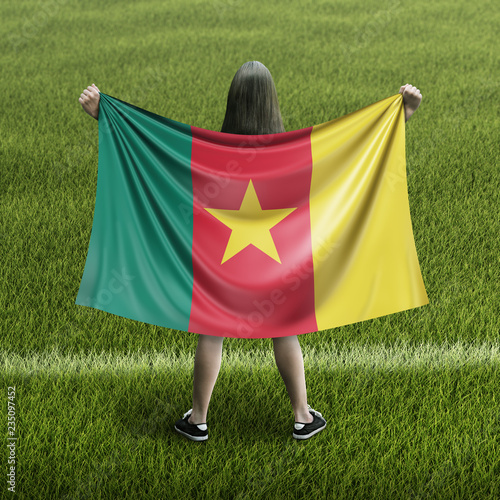 Women and Cameroon flag