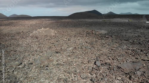 Pull back and panning up drone shot of a volcanic landscape