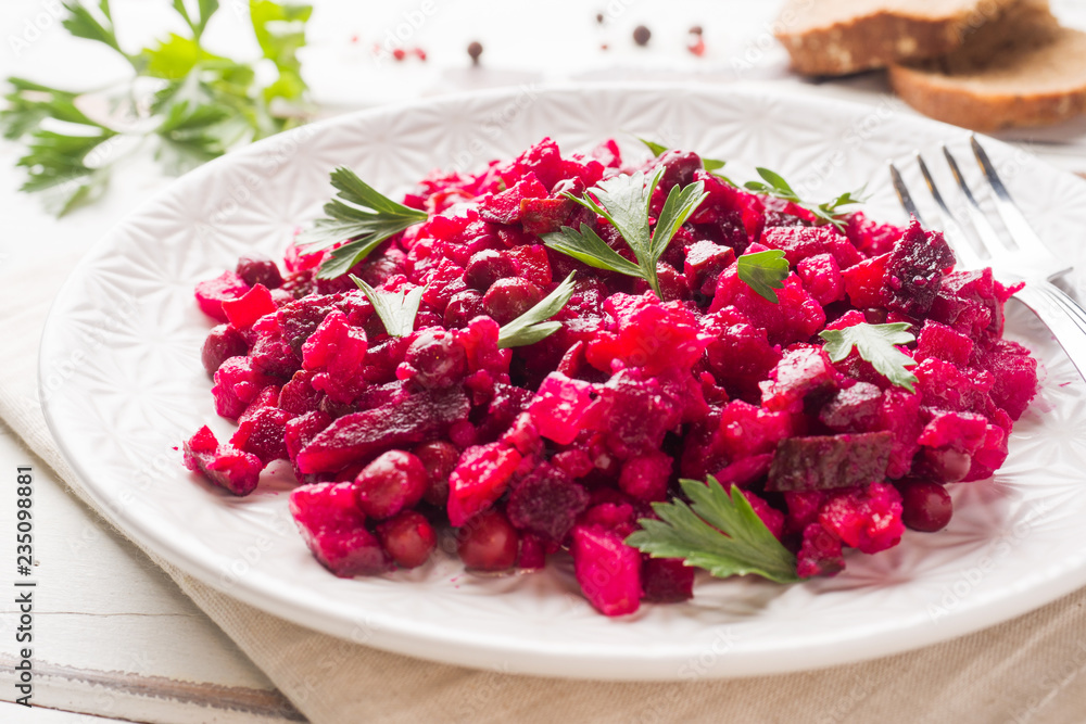 Fresh homemade Beetroot salad Vinaigrette in a white bowl. Traditional Russian food. Fresh homemade Beetroot salad Vinaigrette in a white bowl. Traditional Russian food.