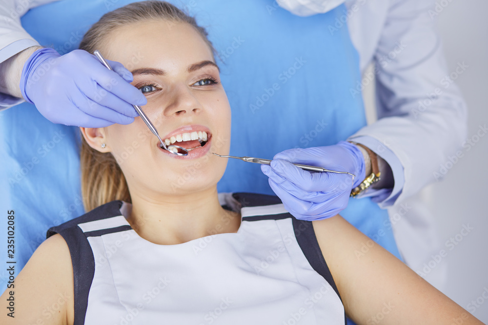 beautiful girl in the dental chair on the examination at the dentist beautiful girl in the dental chair on the examination at the dentist
