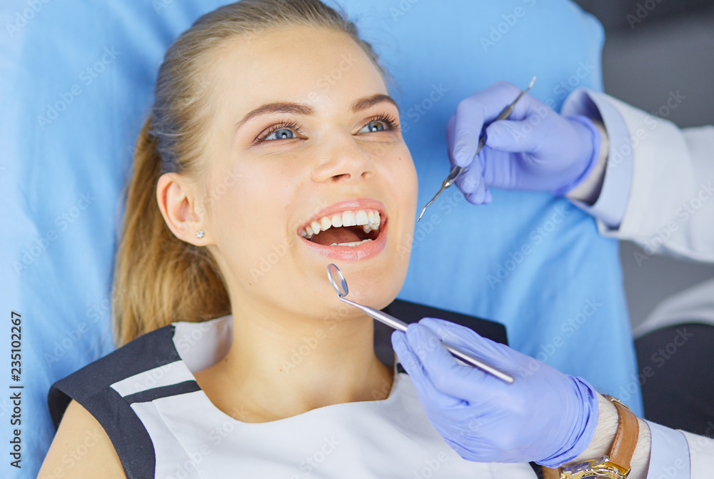 beautiful girl in the dental chair on the examination at the dentist beautiful girl in the dental chair on the examination at the dentist