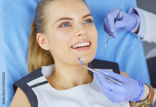 beautiful girl in the dental chair on the examination at the dentist