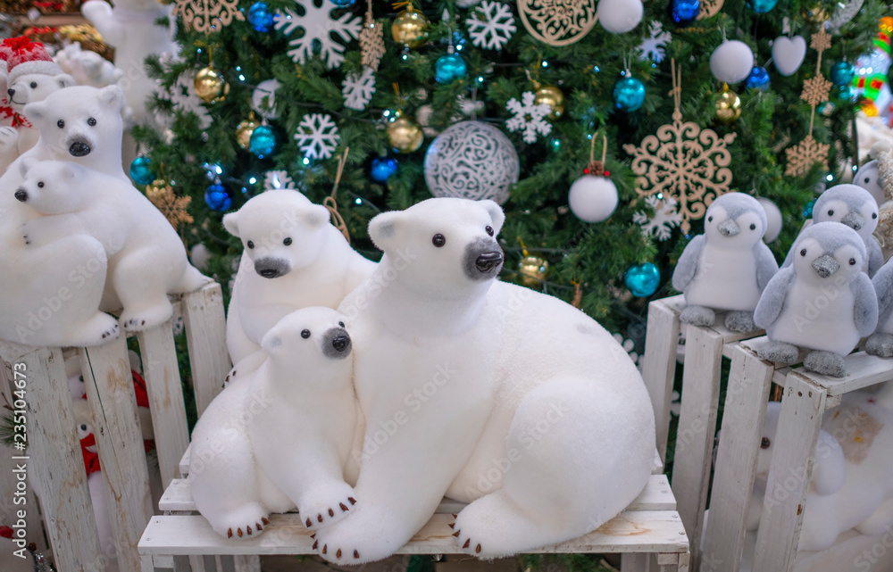 Figurine polar bears toy, near the Christmas tree. Christmas decor ...