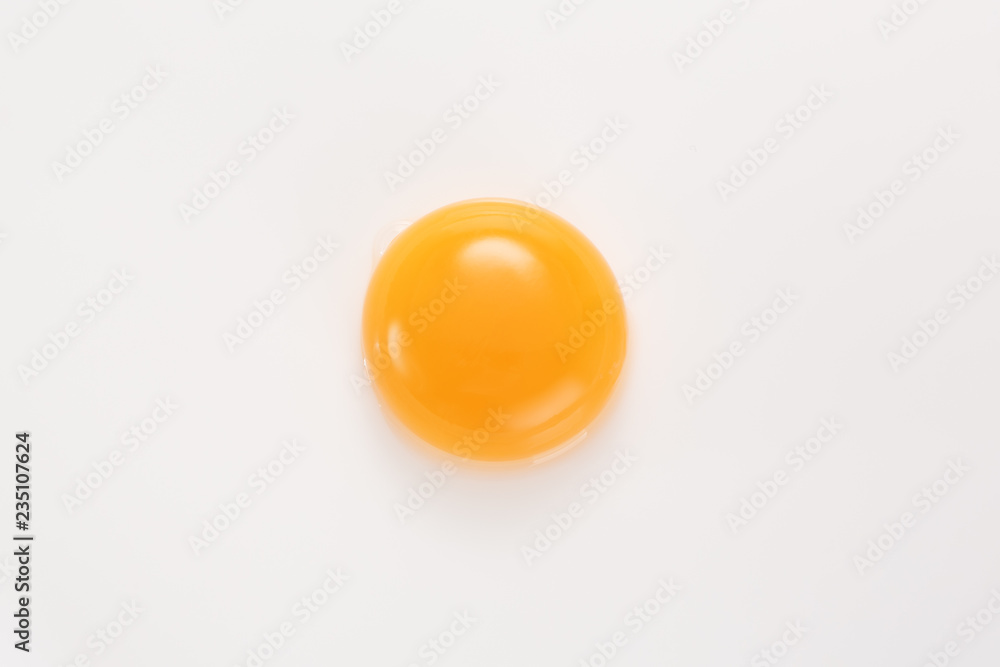 Raw egg yolk on a white background. View from above. - obrazy, fototapety, plakaty 