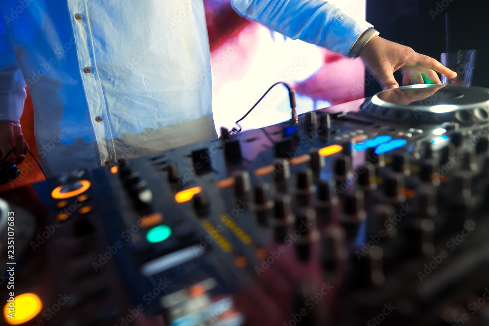 DJ sound equipment at nightclubs and music festivals, EDM, future house music and so on. Parties concept, sound technique. DJ playing on the best DJ sound equipment at nightclubs and music festivals, EDM, future house music and so on. Parties concept, sound technique. DJ playing on the best