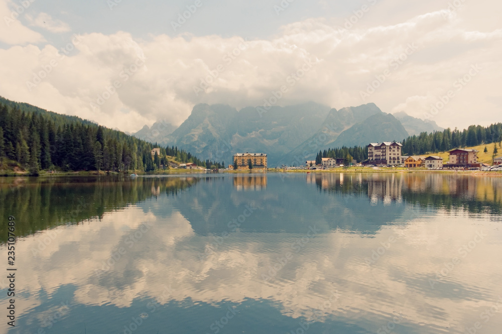 Fototapeta premium Auronzo di Cadore, Italy August 9, 2018: Misurina Mountain Lake. Beautiful tourist place with houses and cafes.