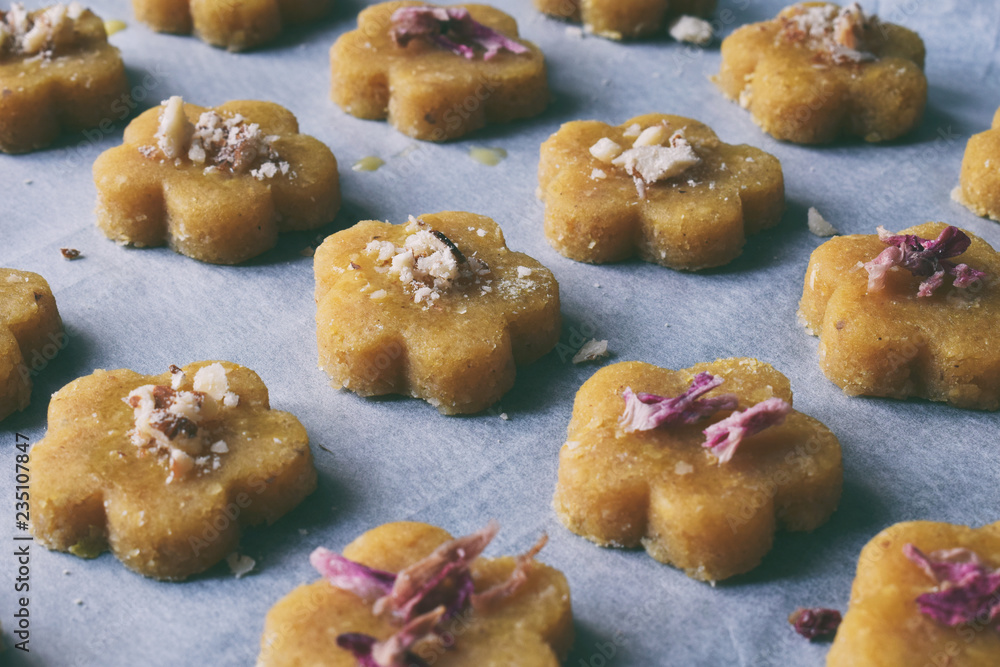 Chickpea cookies pastries with almonds and tea rose petals. Traditional Eastern sweets. Gluten free. Grain free. Paleo diet. Healthy food.