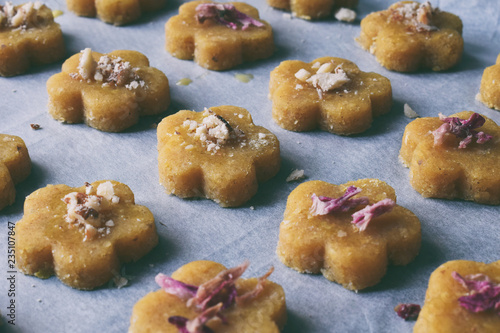 Chickpea cookies pastries with almonds and tea rose petals. Traditional Eastern sweets. Gluten free. Grain free. Paleo diet. Healthy food.