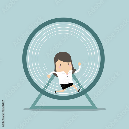 Businesswoman running in a hamster wheel.