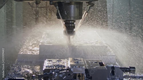 Slow motion of CNC mill manufacturing an advanced metal part