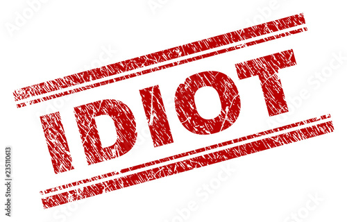 IDIOT seal imprint with corroded texture. Red vector rubber print of IDIOT title with unclean texture. Text title is placed between double parallel lines.
