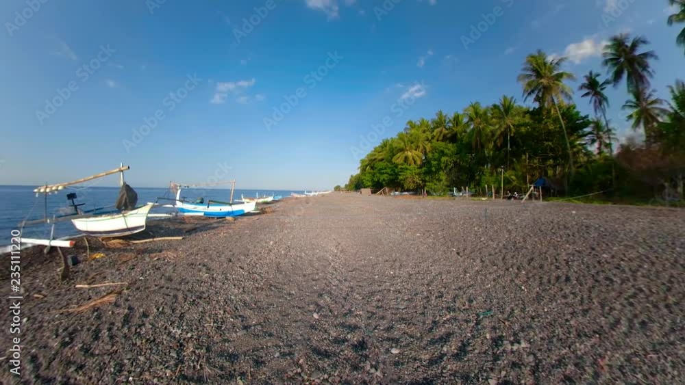 Fishing village with sandy beach and fishing boats panorama 360. tropical landscape Coastline with boats on black sand Fishing village with sandy beach and fishing boats panorama 360. tropical landscape Coastline with boats on black sand