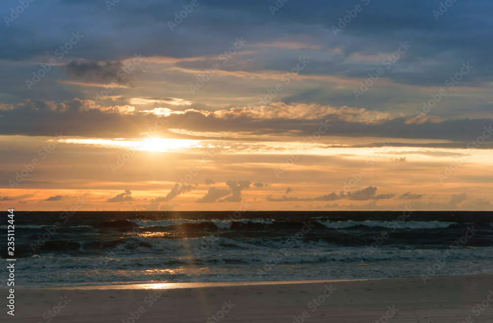 beautiful sunrise and waves on the sea