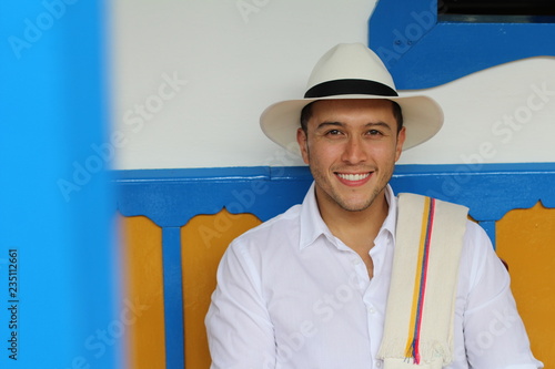 Traditional South American man sitting home