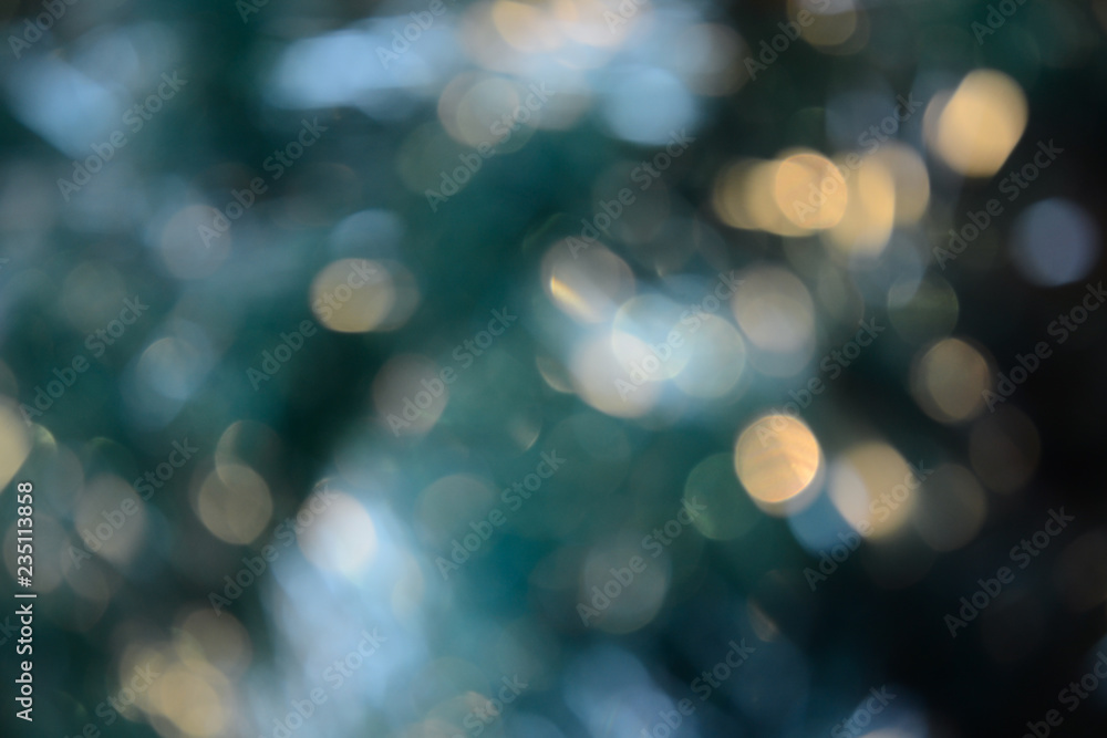 Bokeh photo. Holiday background. Christmas lights. background. Defocused sparkles. New Year backdrop. Festive wallpaper. Blinks. Carnival. Retro style photo.