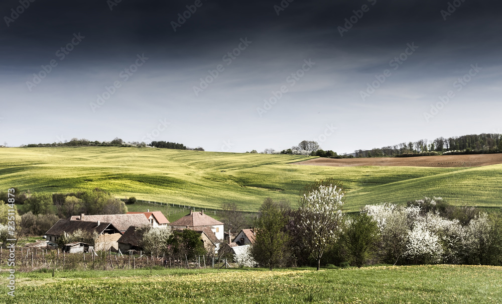 Fototapeta premium Peaceful scene in sunset about a valley with a small village Abaliget, Hungary
