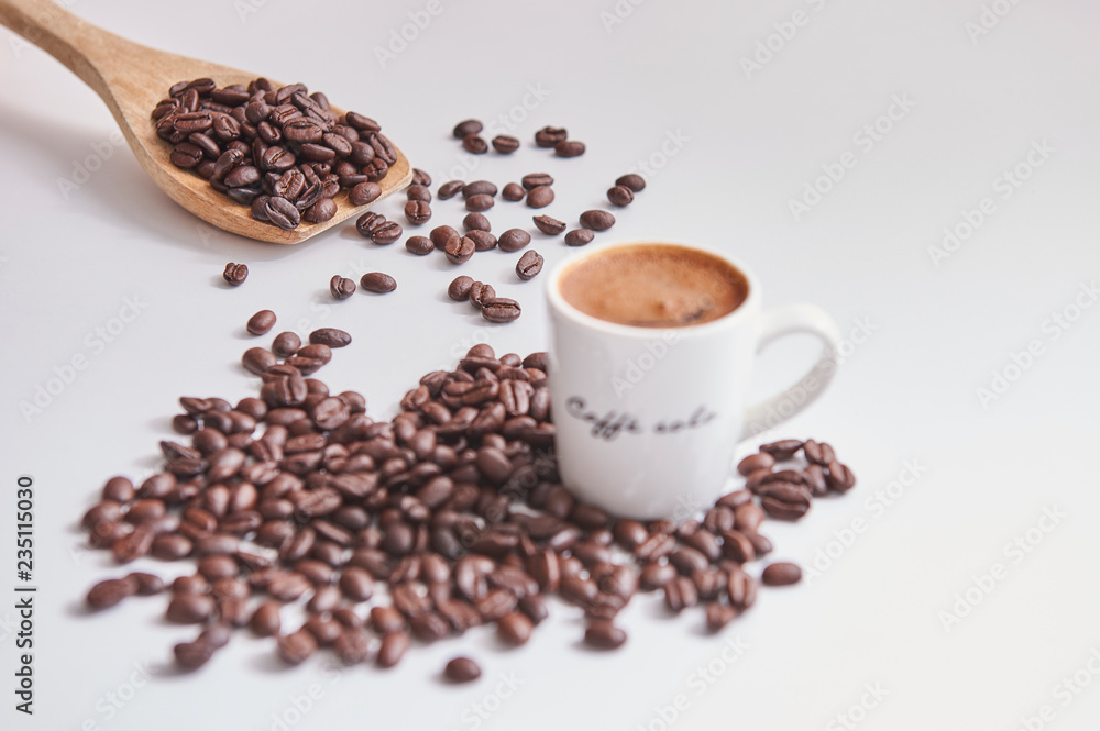 Obraz premium Coffee beans white glass Turkish coffee wooden spoon.