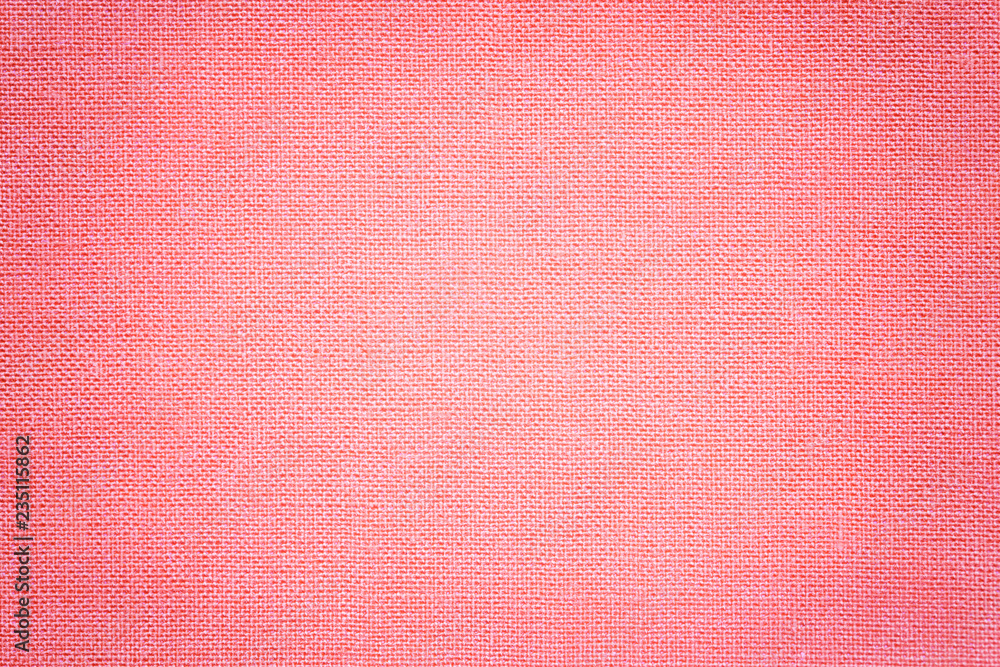 Light pink background from a textile material with wicker pattern, closeup. Light pink background from a textile material with wicker pattern, closeup.