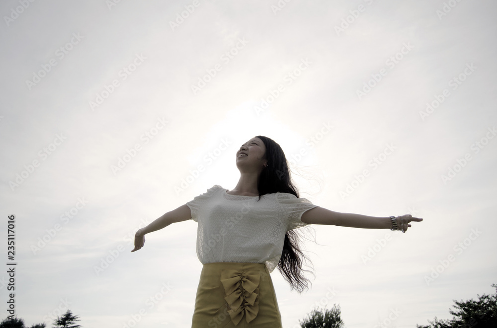 Asian female model poses for pictures in the nature