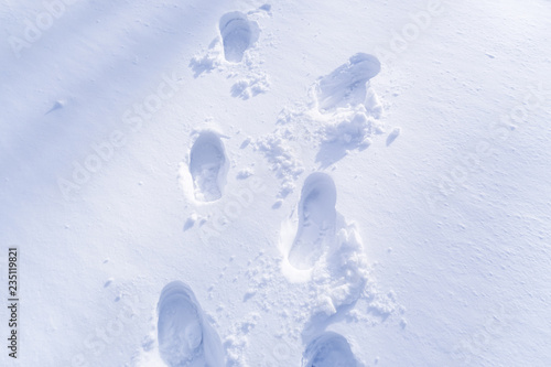 Footprint and hands on snow