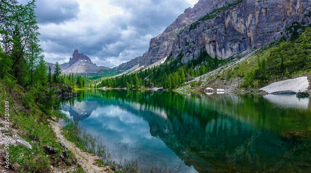 The panorama view of  Federa lake with the background of Dolomites Alps, Cortina D'Ampezzo, South Tyrol, Dolomites, Italy.