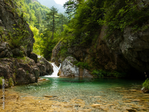 Small waterfall with perfectly clear water, Olympus National Park, Enipeas Canyon, Greece