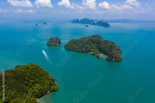 Aerial drone view of beautiful lush green tropical islands with remote, empty bays and beaches © whitcomberd