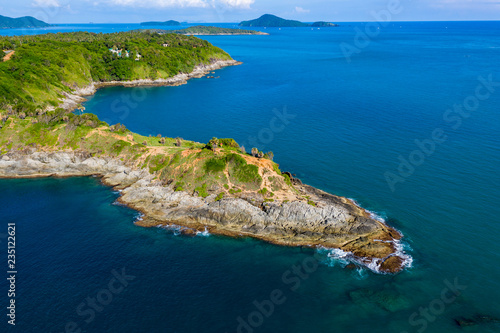 Aerial view of a rocky peninsula leading into a tropical oceal (Promthep Cape, Phuket)