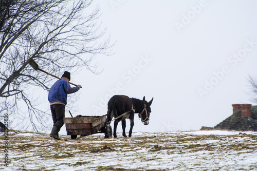 Farmer working in traditional Romanian household