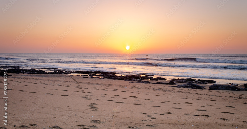 Sunset and Footprints at the Beach