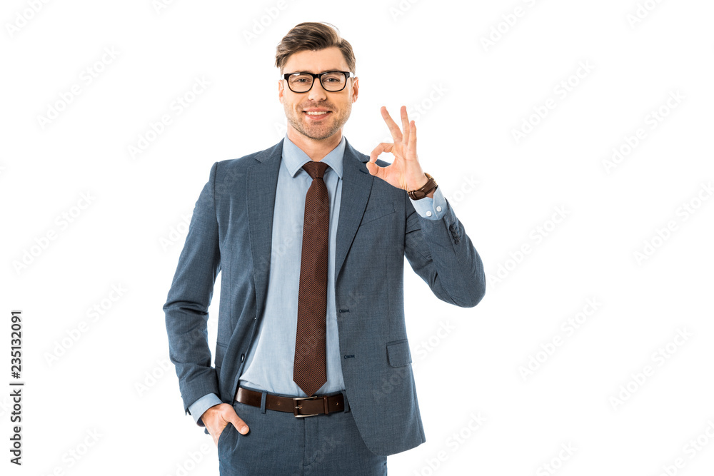 smiling businessman in glasses and suit showing ok sign isolated on white smiling businessman in glasses and suit showing ok sign isolated on white