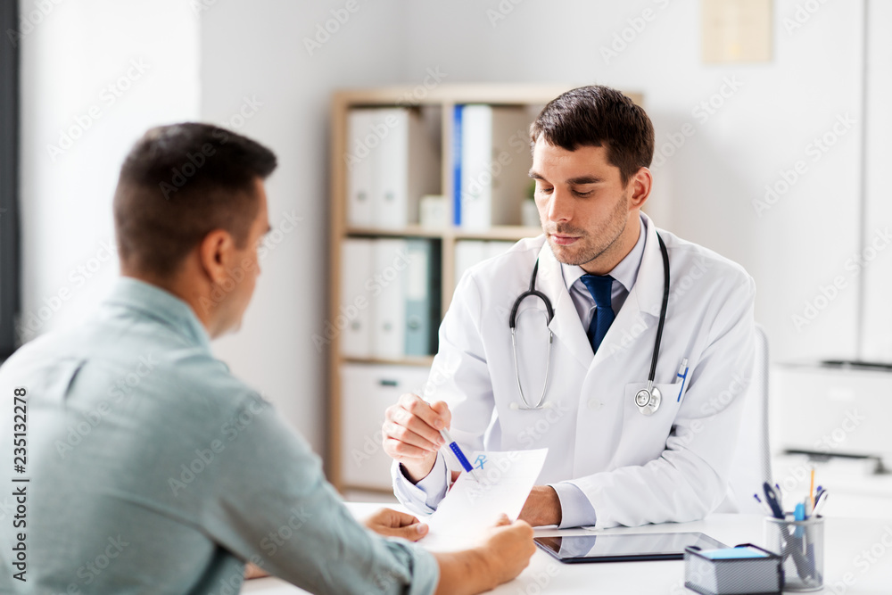 medicine, healthcare and people concept - doctor showing prescription to patient at medical office in hospital medicine, healthcare and people concept - doctor showing prescription to patient at medical office in hospital