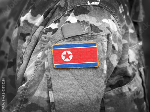 North Korea flag on soldiers arm (collage). photo